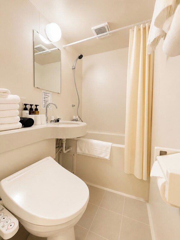A modern bathroom with a toilet, sink, and shower. - Hotel Sho Sapporo (ParkSide Hotel) (Sapporo)