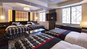 A hotel room with two beds, a flat-screen TV, a desk, and large windows with geometric patterns. - New Otani Inn Tokyo (Tokyo)