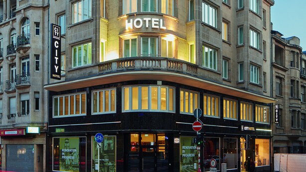 A CITY HOTEL with a prominent sign, large windows, and a modern facade. - City Hotel (Luxembourg City)