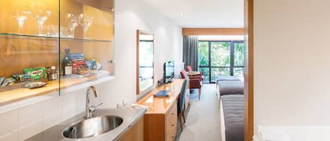 Premium Family Room (1 Queen and 2 Singles) | Private kitchen | Fridge, microwave, coffee/tea maker