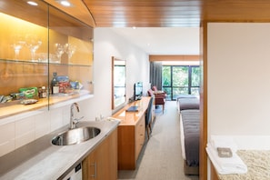Premium Family Room (1 Queen and 2 Singles) | Private kitchen | Fridge, microwave, coffee/tea maker