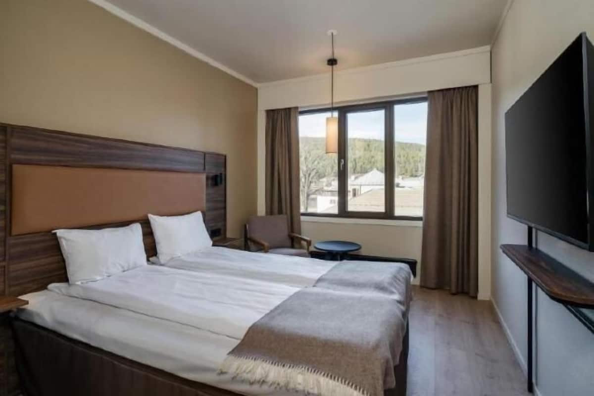 Desk, laptop workspace, blackout drapes, soundproofing