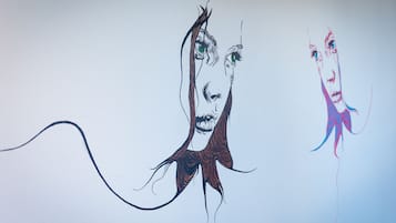 A drawing of a person with long hair and a scarf.