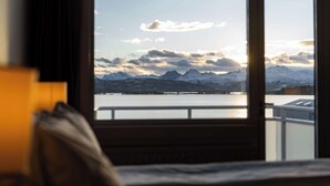 A room with a view of snow-capped mountains and a body of water. - Scandic Alexandra Molde (Molde)