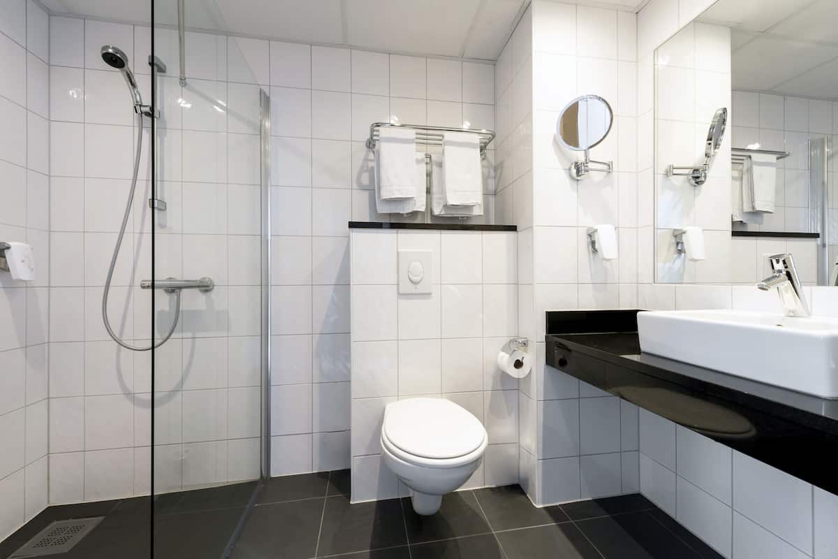 separate bathtub and shower, hair dryer, towels, soap