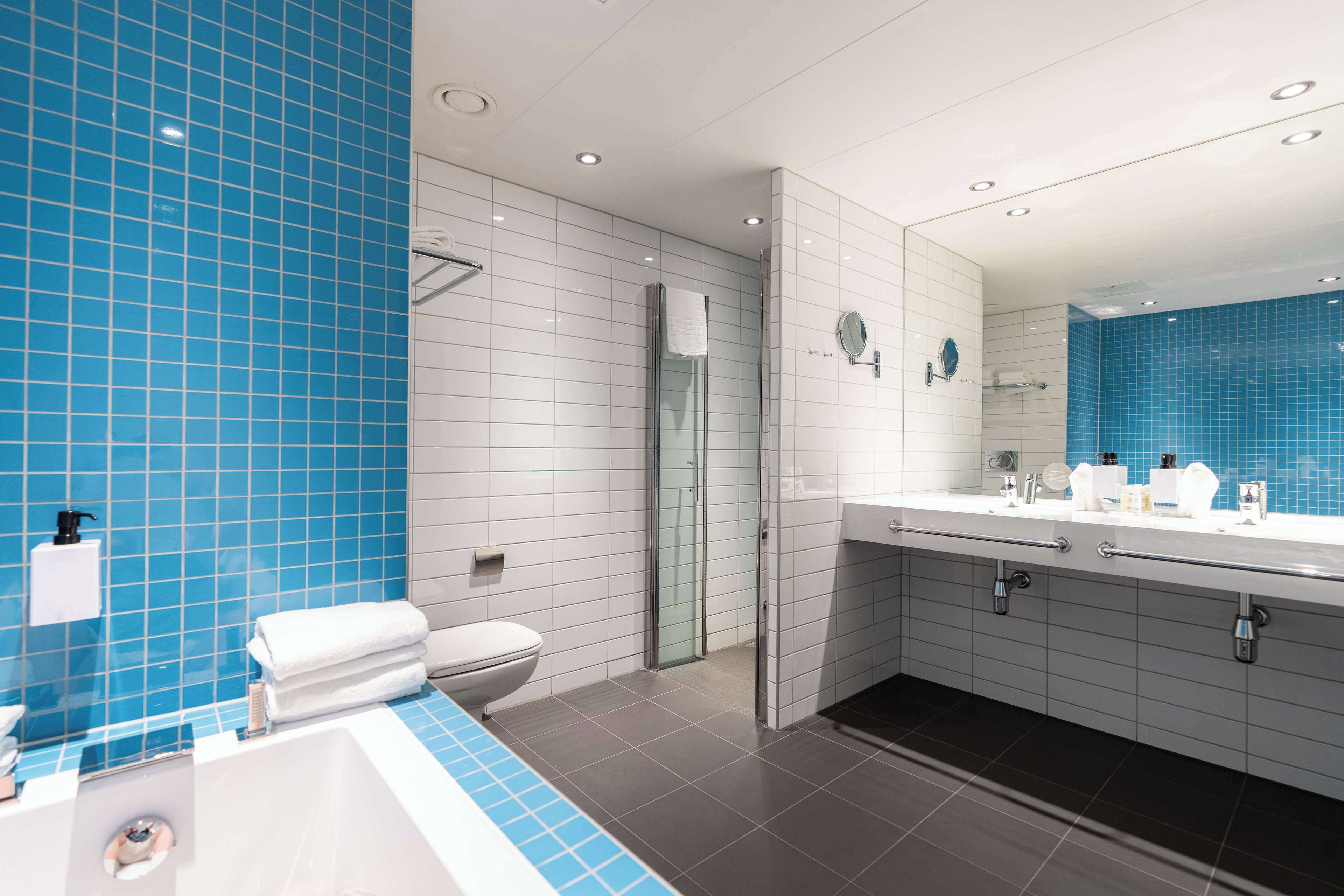 shower, hair dryer, heated floors, towels