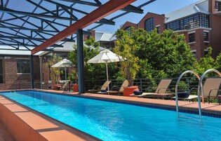 Outdoor pool, open 7:00 AM to 7:00 PM, pool umbrellas, sun loungers