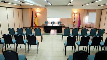 A conference room with a long table and chairs arranged for a meeting.