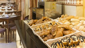 A bakery display with various pastries and bread. - Eurostars Maimónides Hotel (Córdoba)