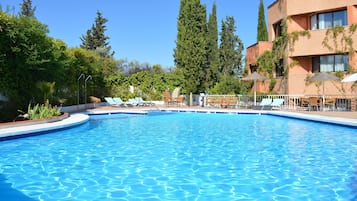 Seasonal outdoor pool, open 11 AM to 8 PM, pool umbrellas, pool loungers