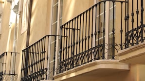 A building facade with ornate balconies and classical architectural details.
