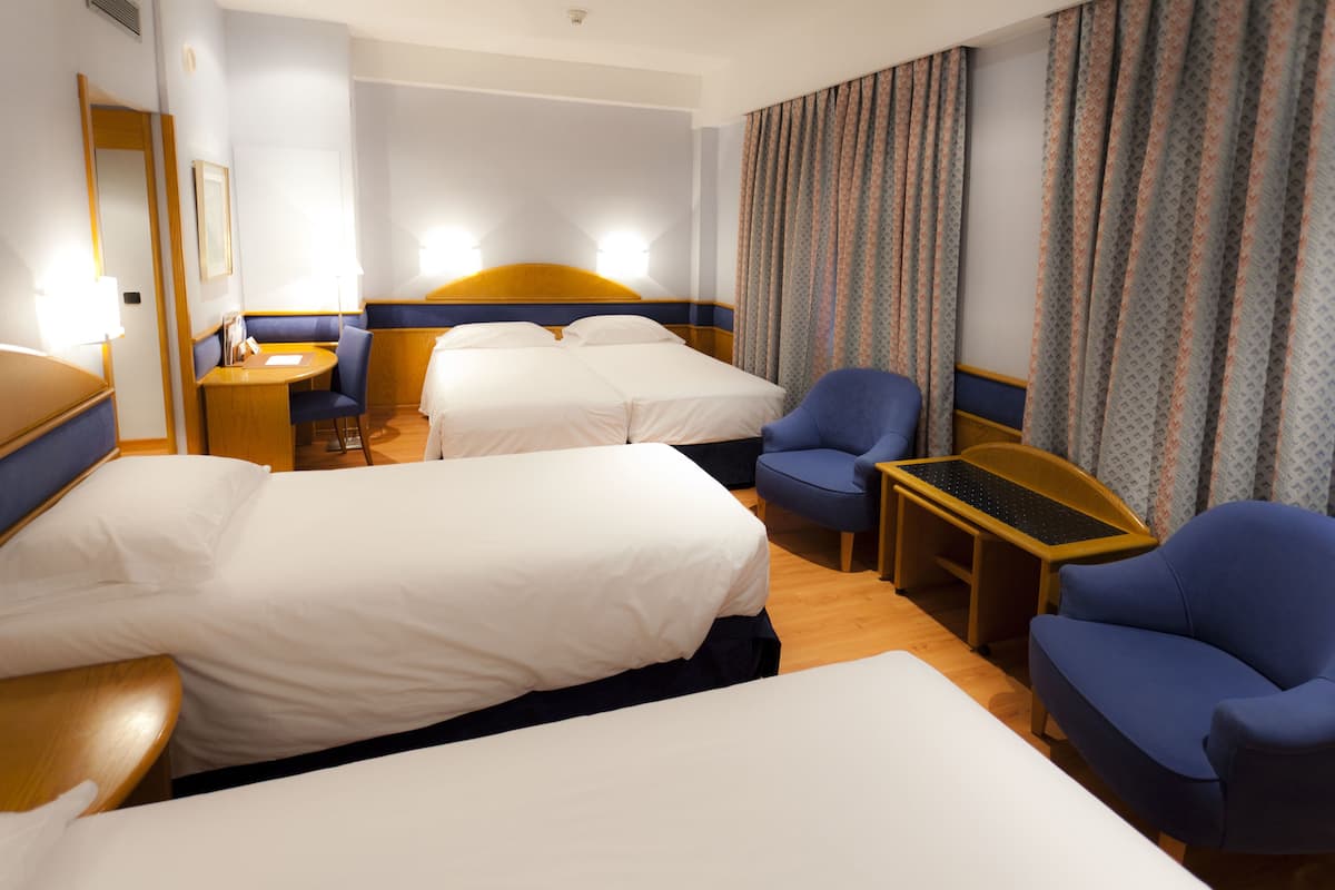 Quadruple Room | Minibar, in-room safe, desk, laptop workspace