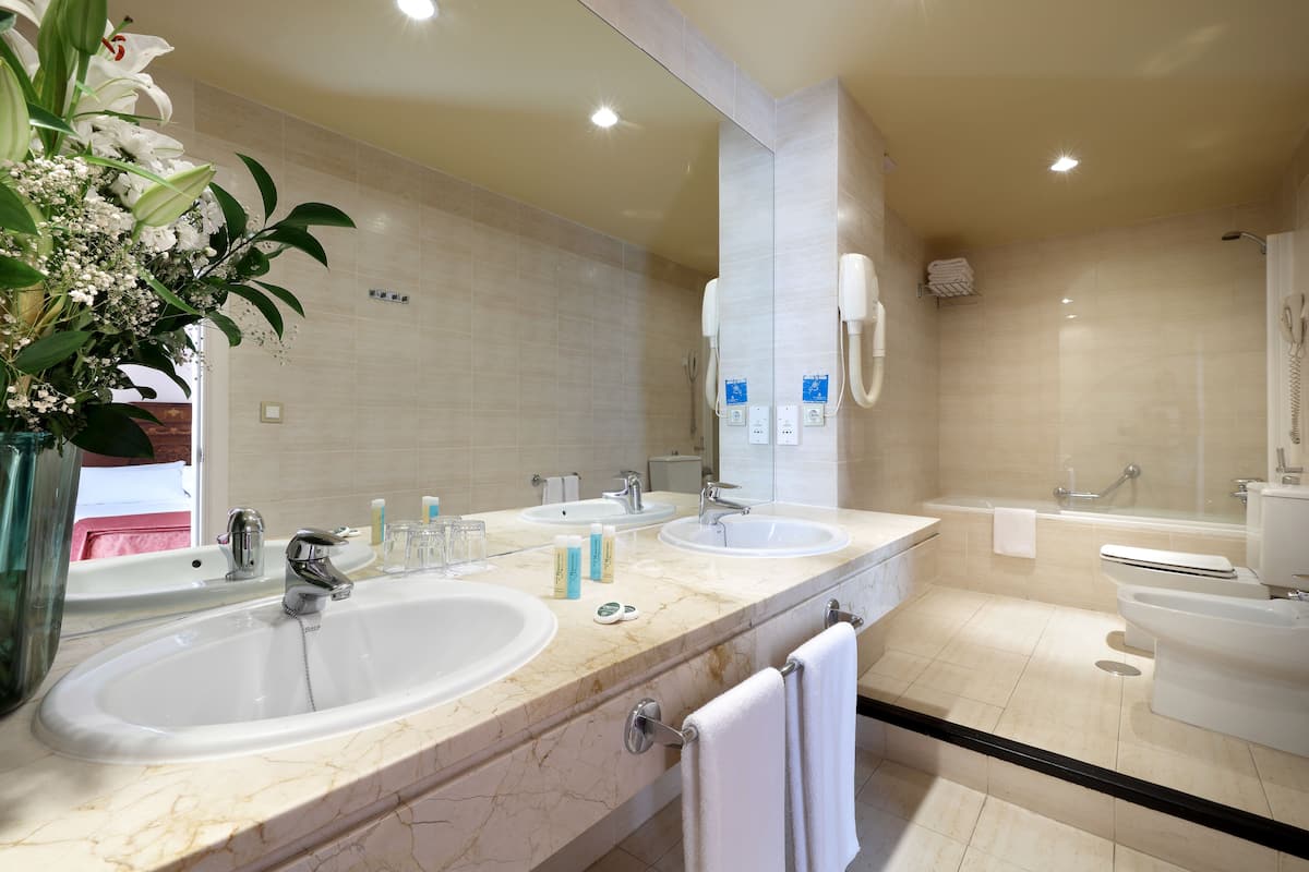 eco-friendly toiletries, hair dryer, bidet, towels