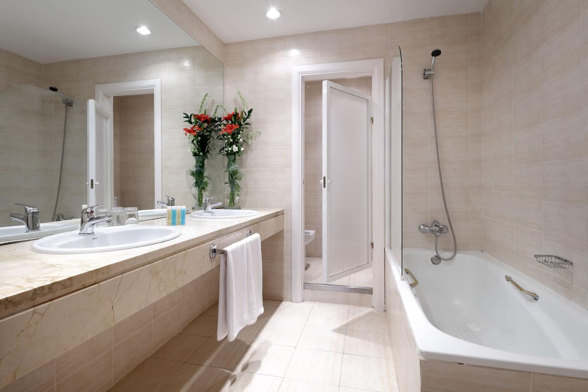 eco-friendly toiletries, hair dryer, bidet, towels