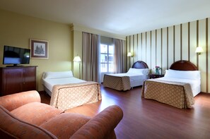 Triple Room | Minibar, in-room safe, blackout drapes, free WiFi