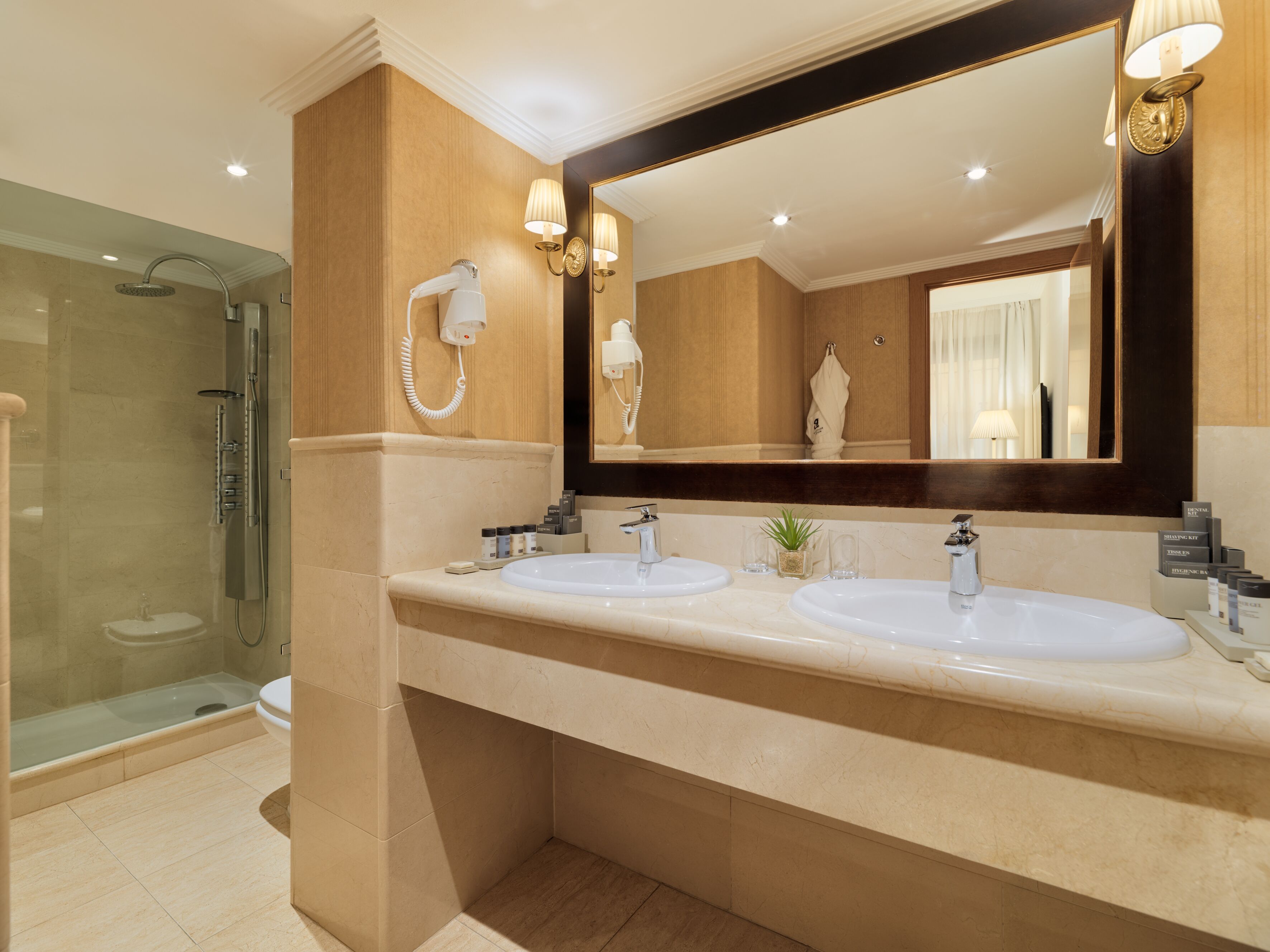 junior suite | bathroom | eco-friendly toiletries, hair dryer, bathrobes, slippers