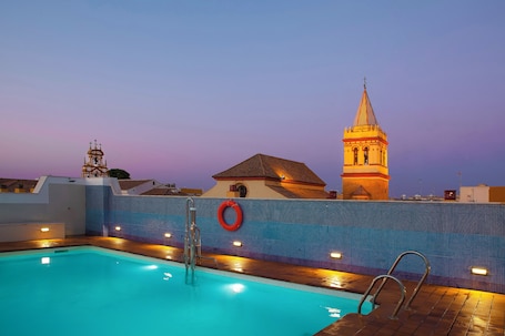 Seasonal outdoor pool, open 10:00 AM to 8:00 PM, sun loungers