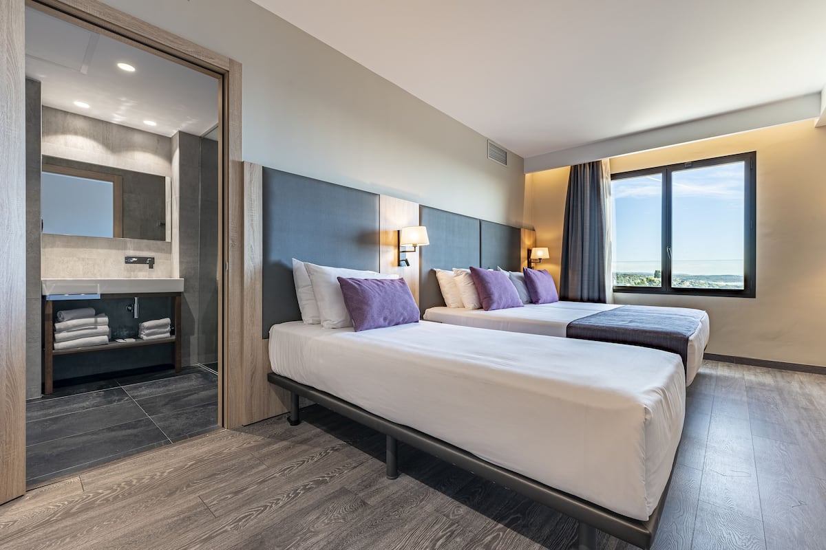 Triple Room, Multiple Beds, Garden View | Down comforters, minibar, desk, blackout drapes