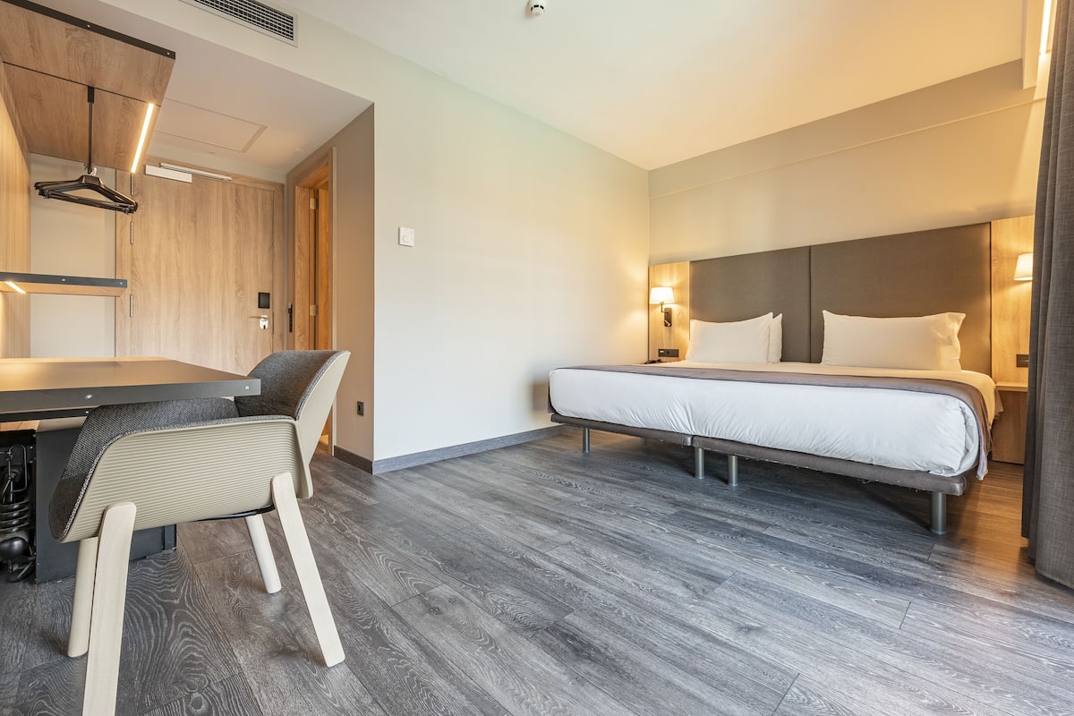 Double Room, Pool View | Down comforters, minibar, desk, blackout drapes
