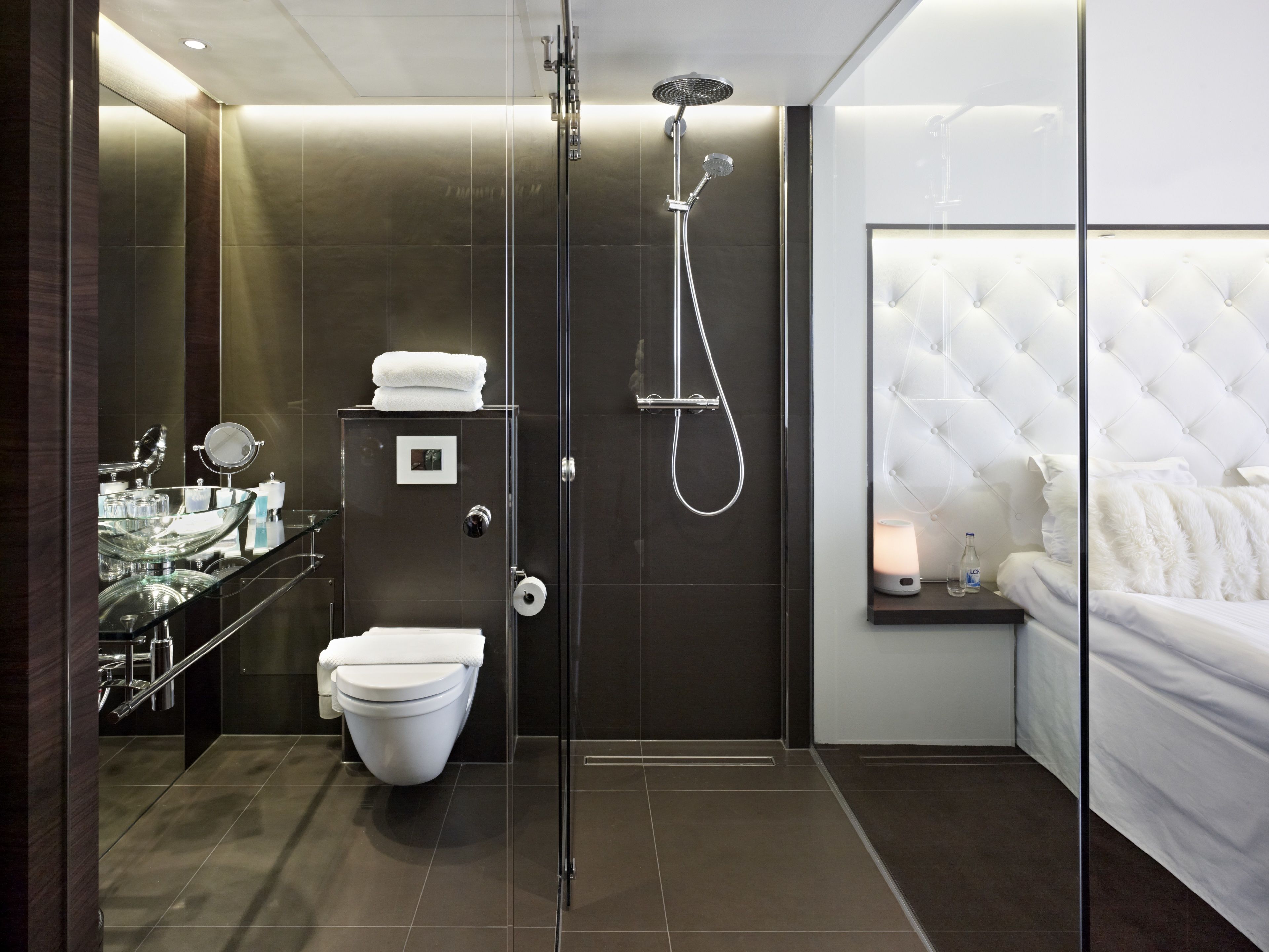 designer toiletries, hair dryer, towels, soap