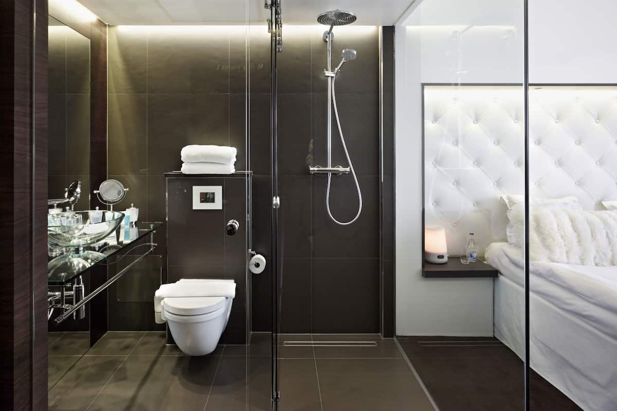 designer toiletries, hair dryer, towels, soap