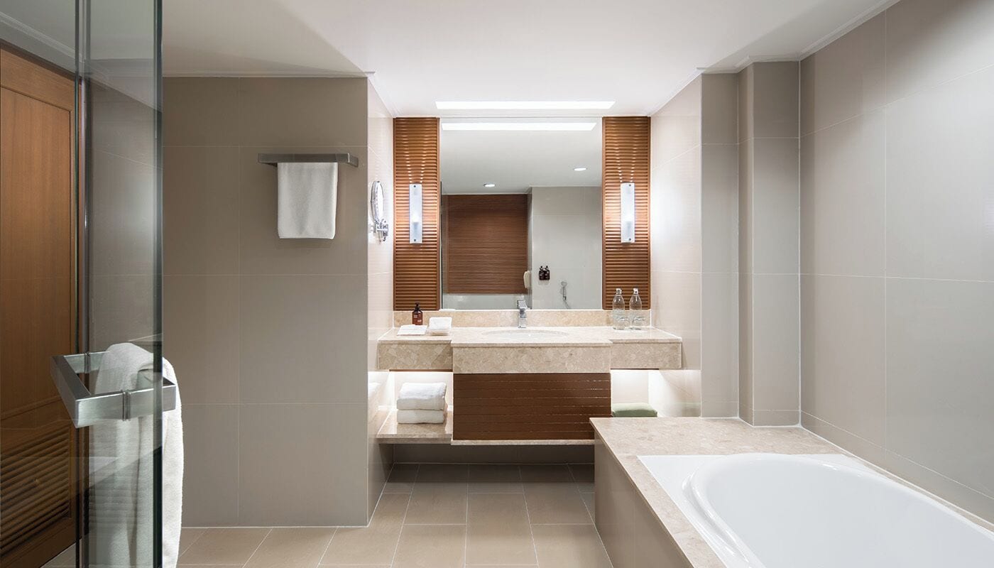 junior suite twin with exclusive benefits | bathroom | designer toiletries, hair dryer, bathrobes, slippers