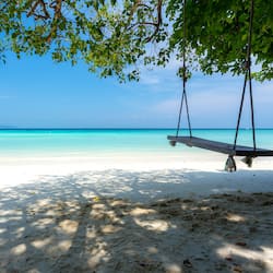 On the beach, white sand, beach towels, scuba diving