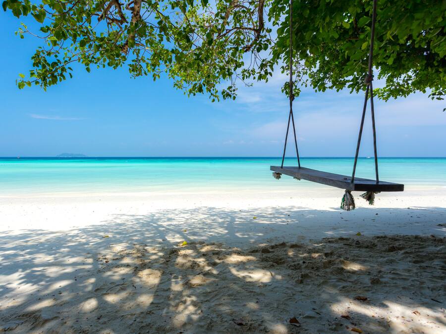 On the beach, white sand, beach towels, scuba diving