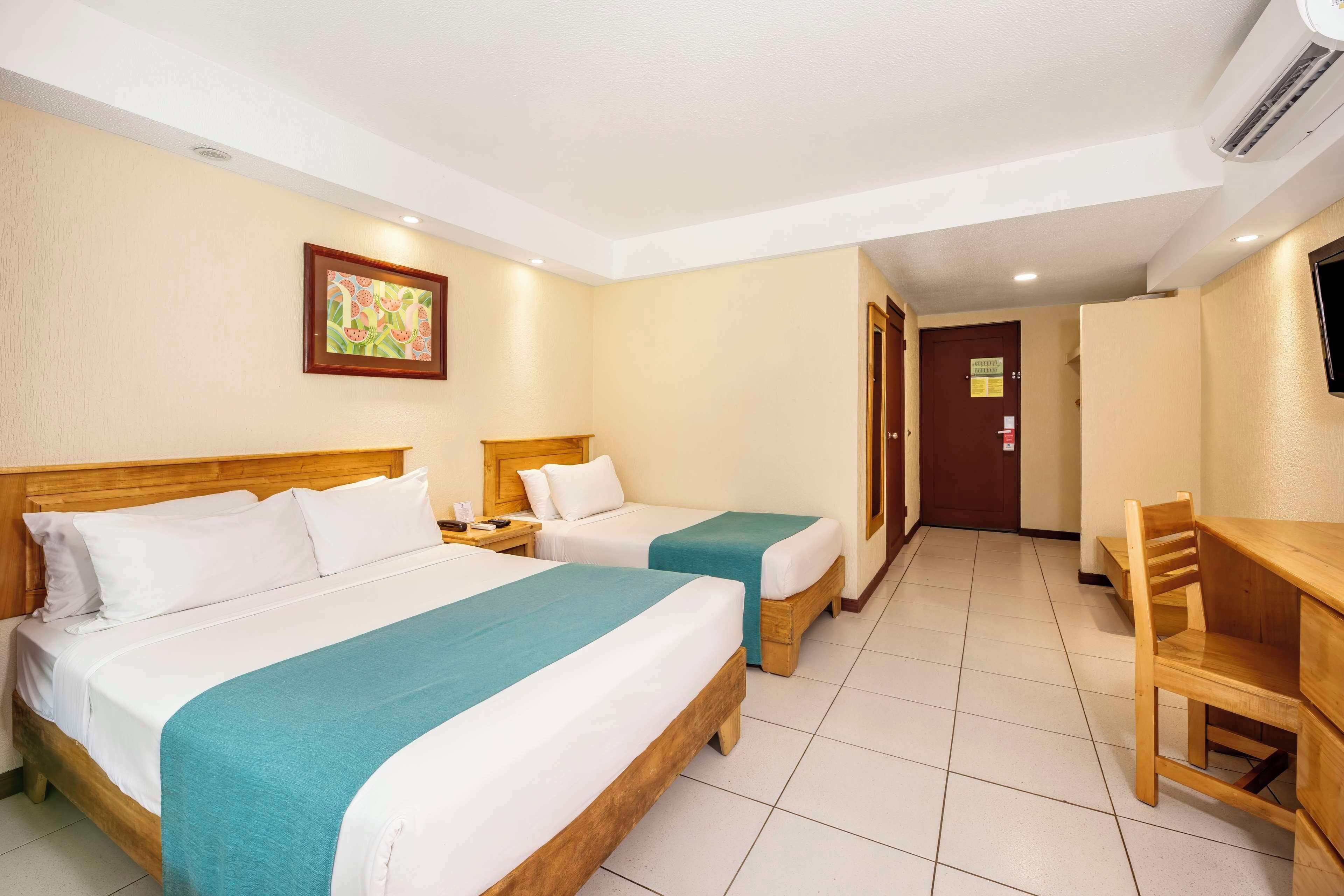 Standard Room, Multiple Beds, Accessible, Garden View | In-room safe, desk, blackout drapes, iron/ironing board