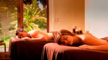 Relax in a serene spa setting with a view of lush greenery.