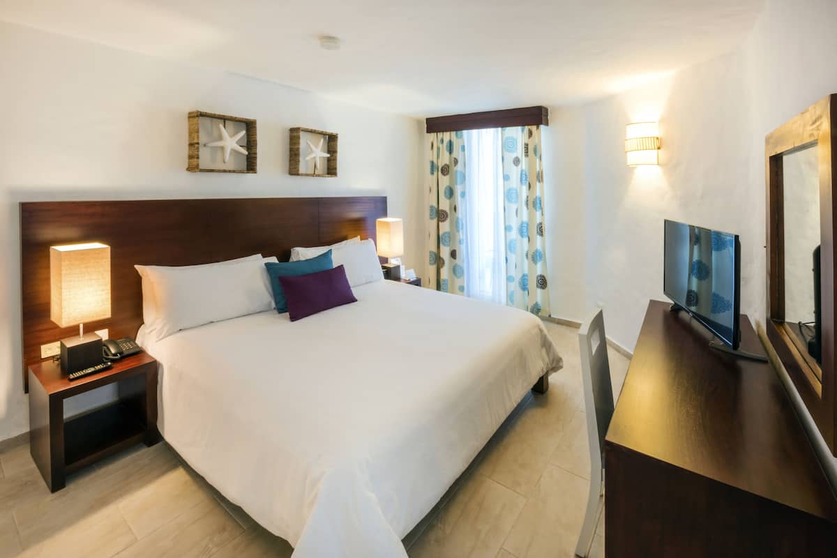 Down comforters, pillowtop beds, in-room safe, desk