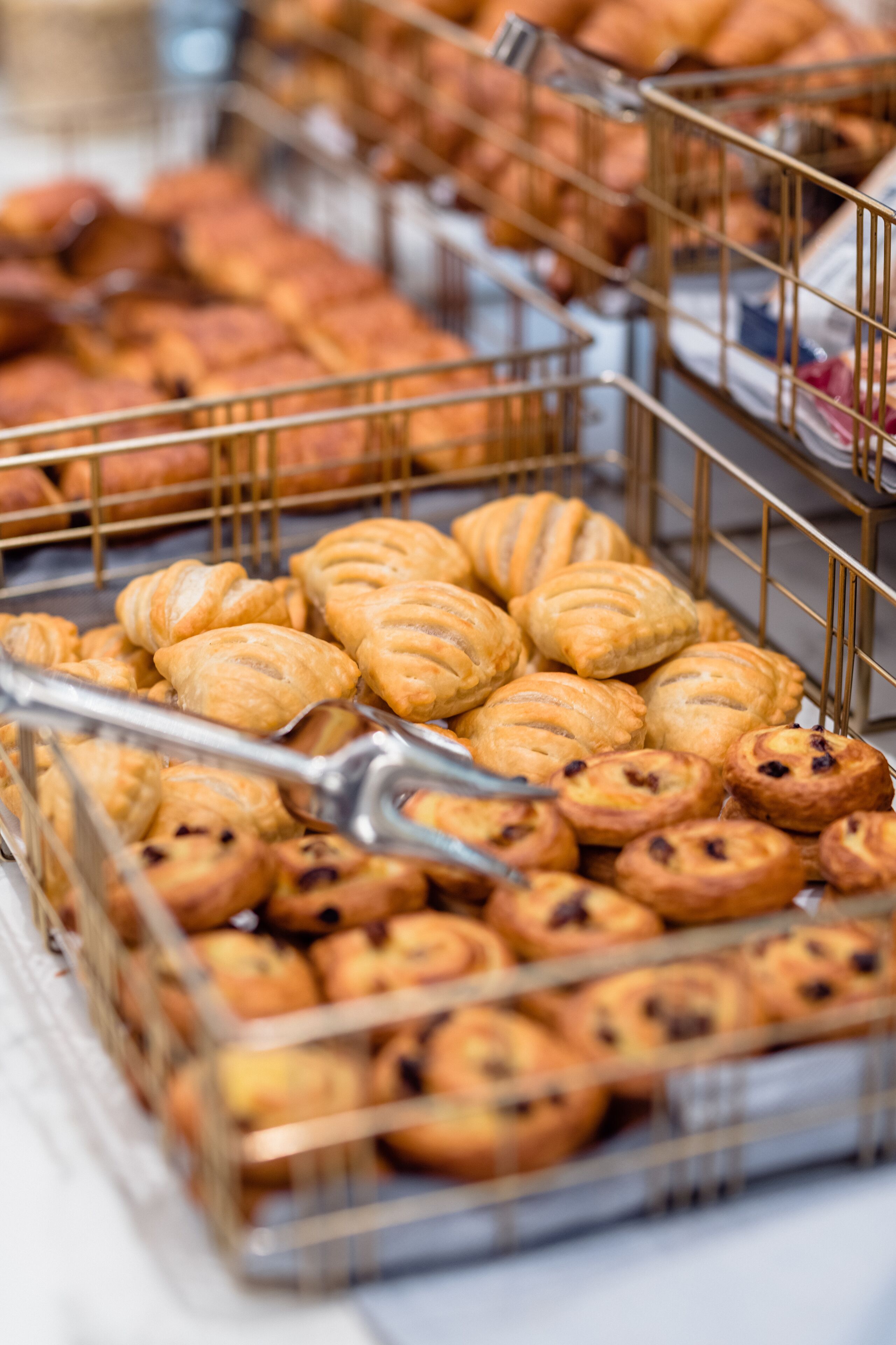 A display of pastries in a bakery.