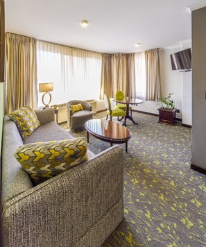 Deluxe Suite | Living area | Flat-screen TV