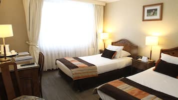 Standard Twin Room | In-room safe, desk, laptop workspace, blackout curtains