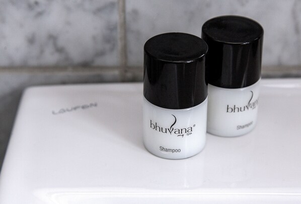 Two bottles of bhuvana spa shampoo on a white surface. - Hotel Europa (Aabenraa)