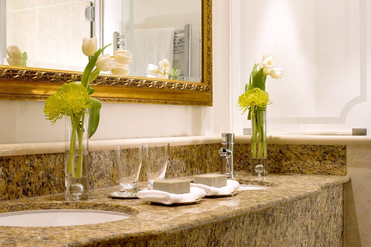 designer toiletries, hair dryer, bathrobes, slippers