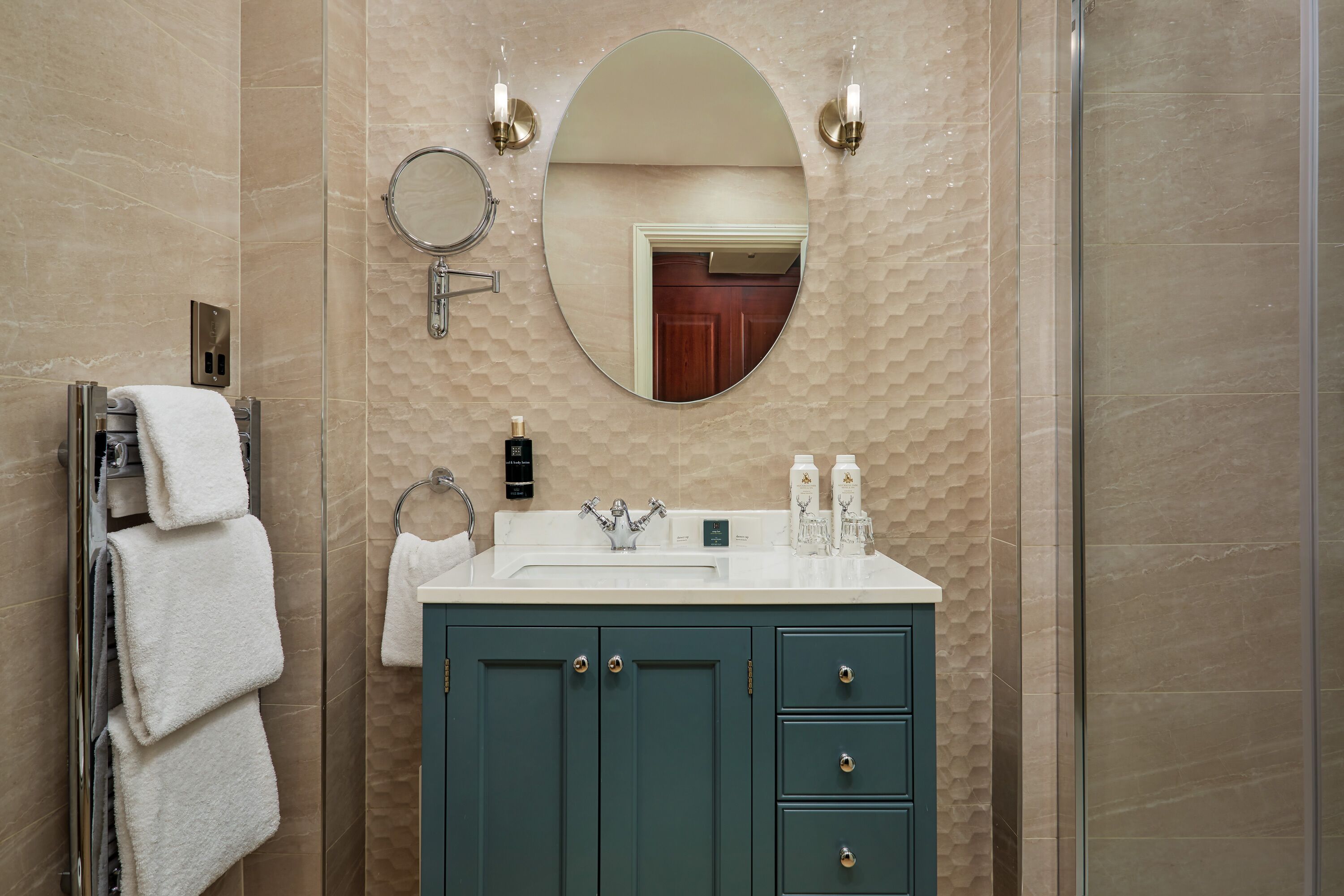 designer toiletries, hair dryer, bathrobes, slippers