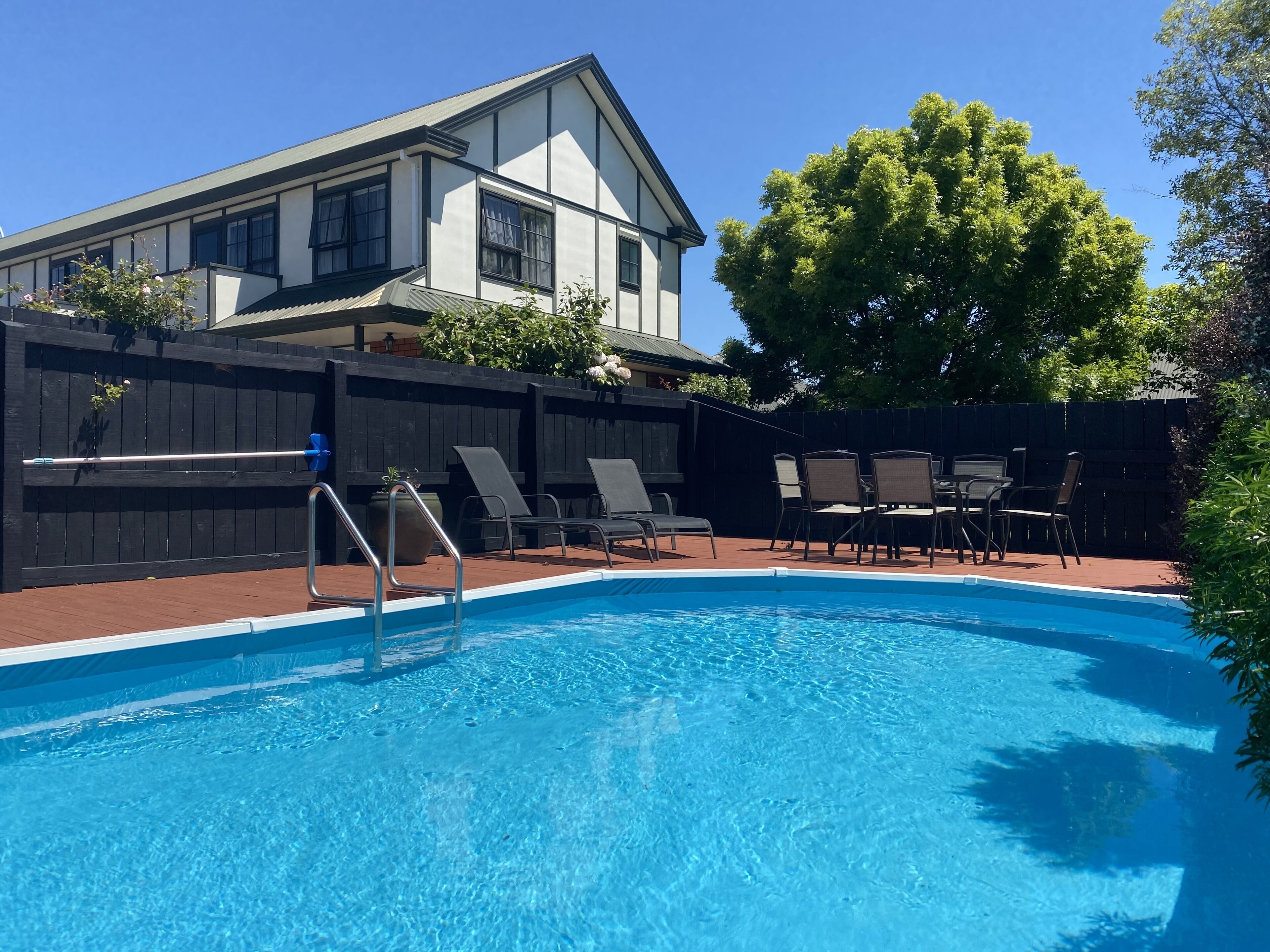 Seasonal outdoor pool, pool loungers