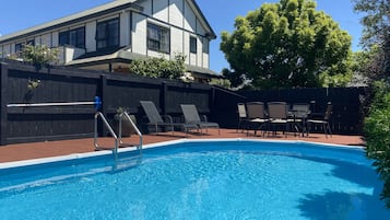 Seasonal outdoor pool, pool loungers