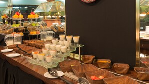 A buffet setup with various food items and beverages. - Distinction Whangarei Hotel & Conference Centre (Whangarei)