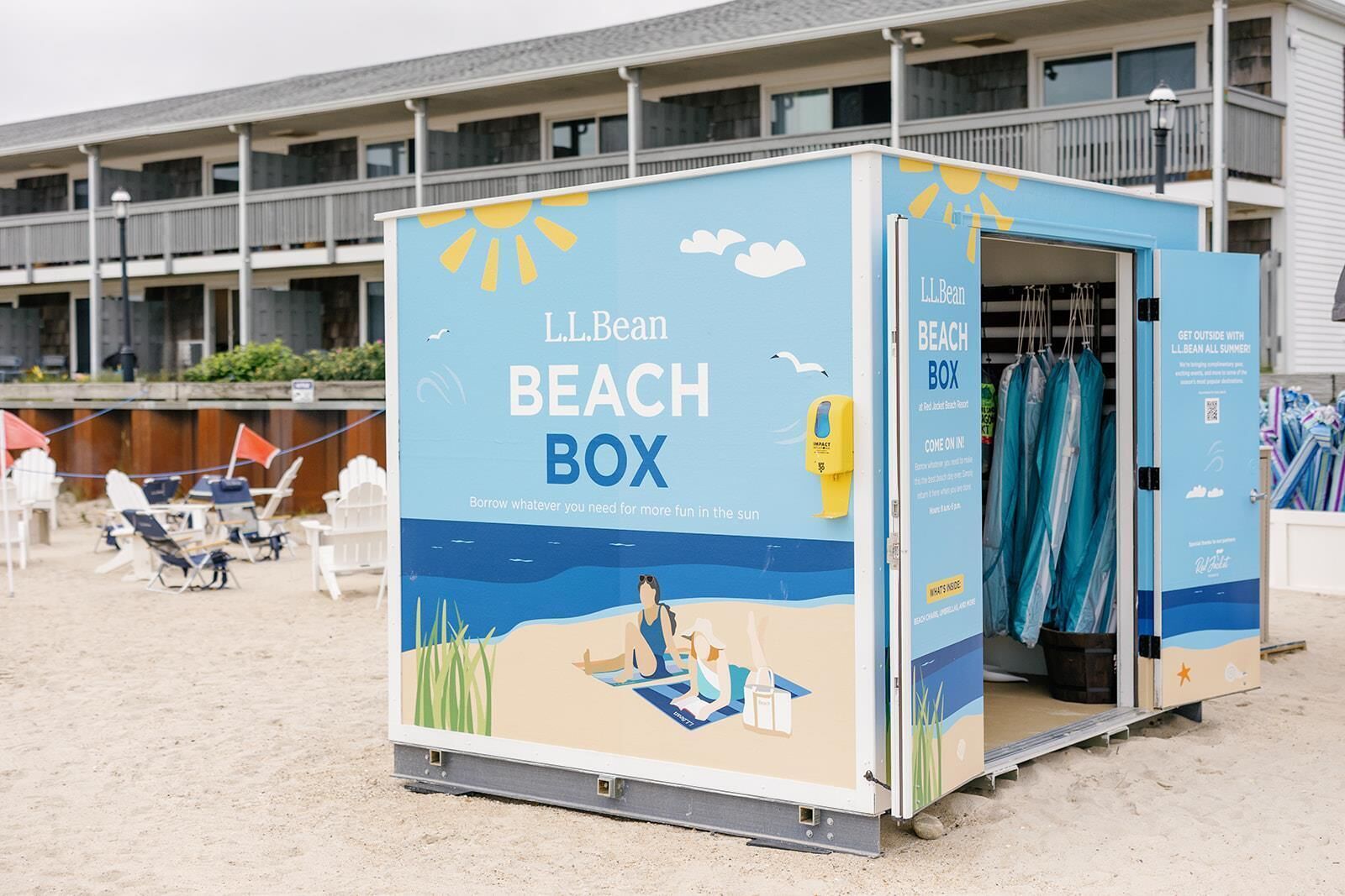A beach box with a sun and clouds illustration, labeled "LLBean Beach Box," and a sign indicating it is a rental service.