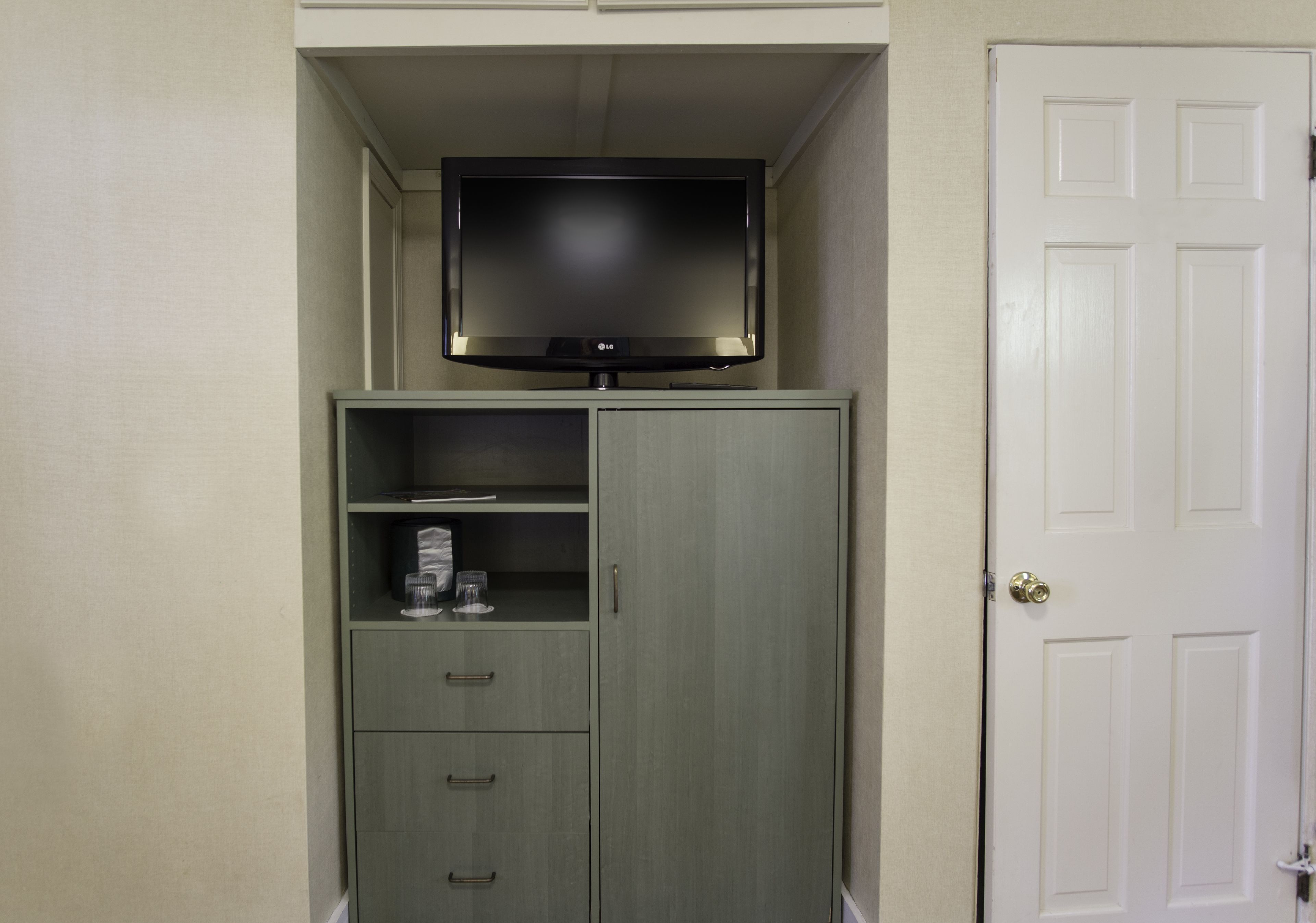 economy room, 2 double beds, ground floor | living area | flat-screen tv