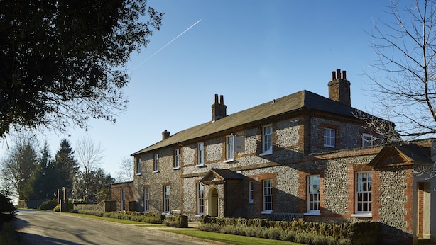 A large stone building with multiple windows and a central entrance. - The Goodwood Hotel (Chichester)