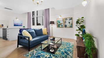 Modern One Bedroom Suite | Living area | 40-inch TV with satellite channels, DVD player