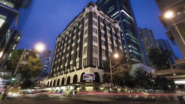 A hotel with a classic facade, multiple floors, and a prominent sign. - Royal Albert Hotel (Brisbane)