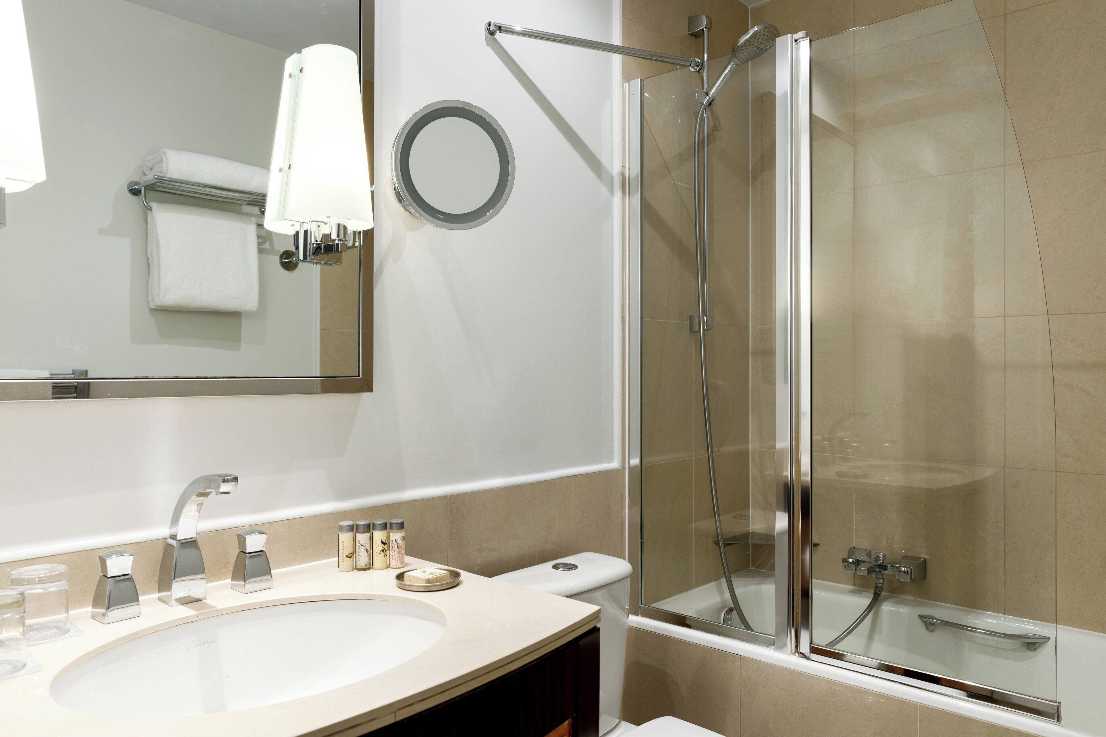 combined shower/bathtub, designer toiletries, hair dryer, bathrobes