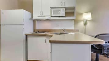 Fridge, microwave, stovetop, coffee/tea maker
