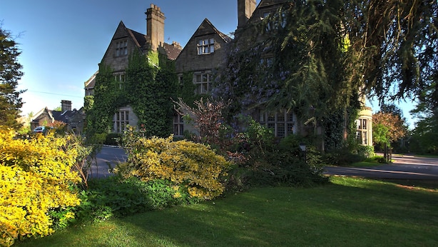 A large, historic stone building with multiple chimneys and ivy-covered walls. - Weston Hall Hotel, Sure Hotel Collection by Best Western (Bedworth)
