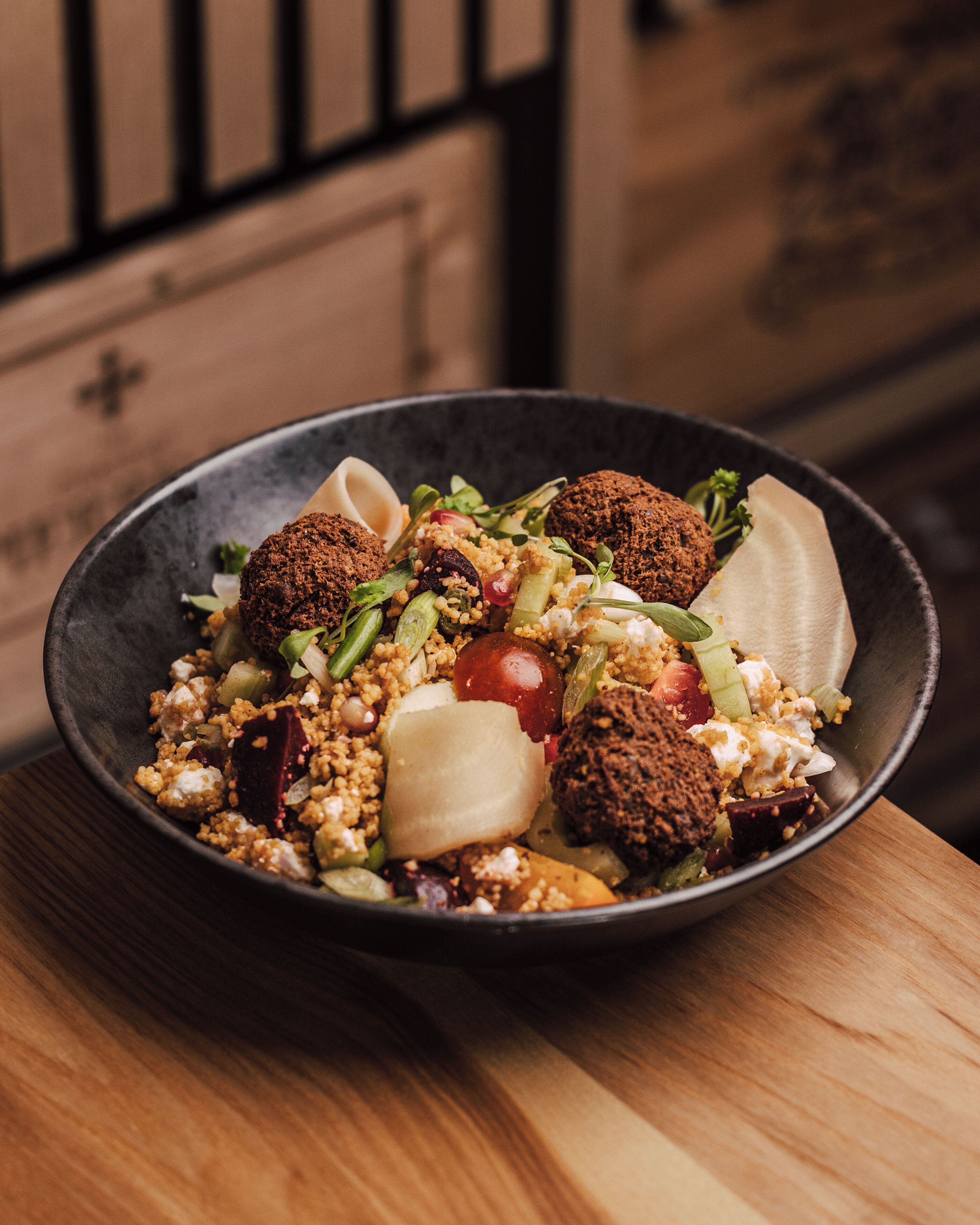 A bowl of salad with various ingredients.