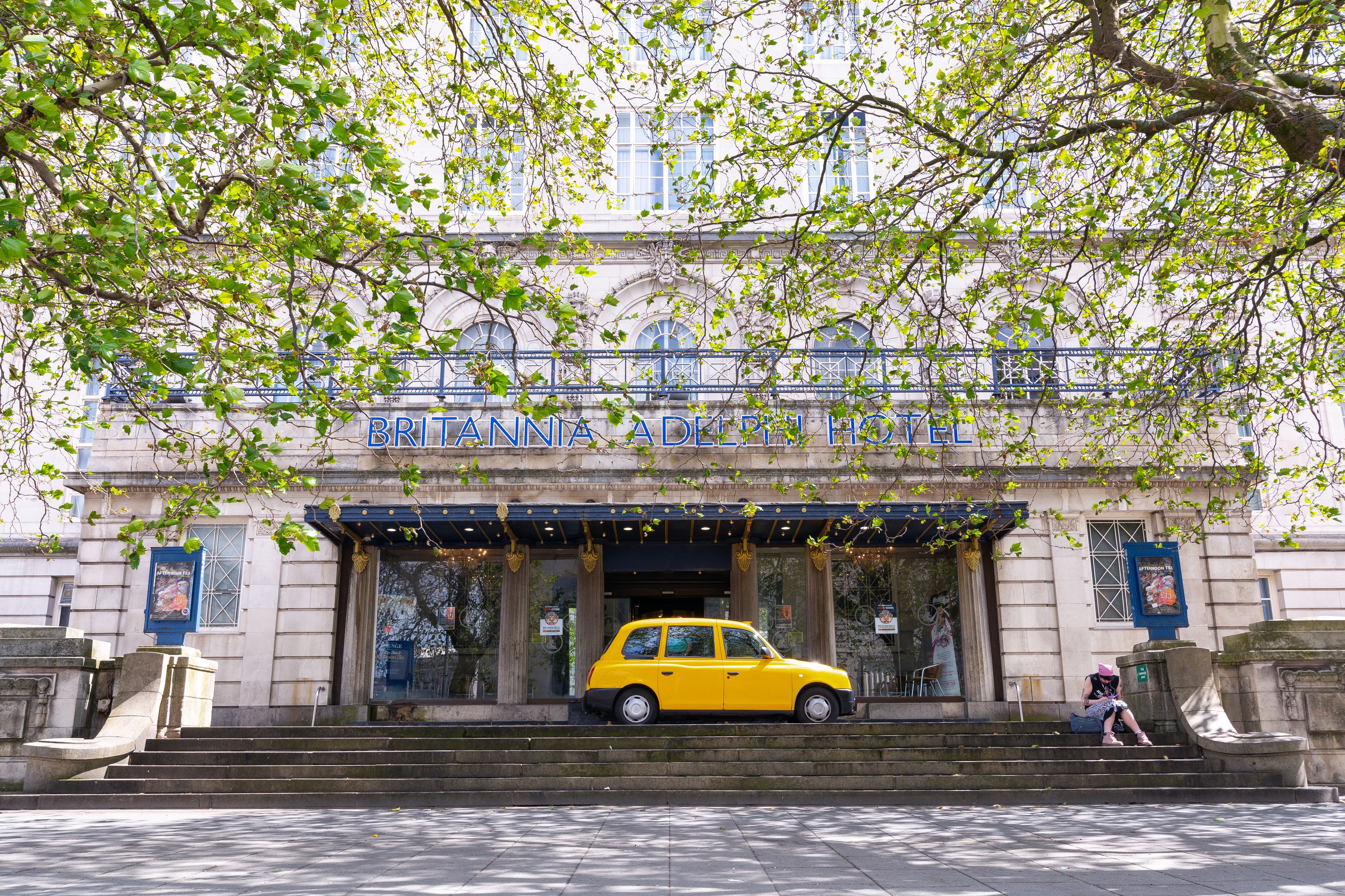A building with a sign reading "BRITANNIA ADELphi HOTEL".